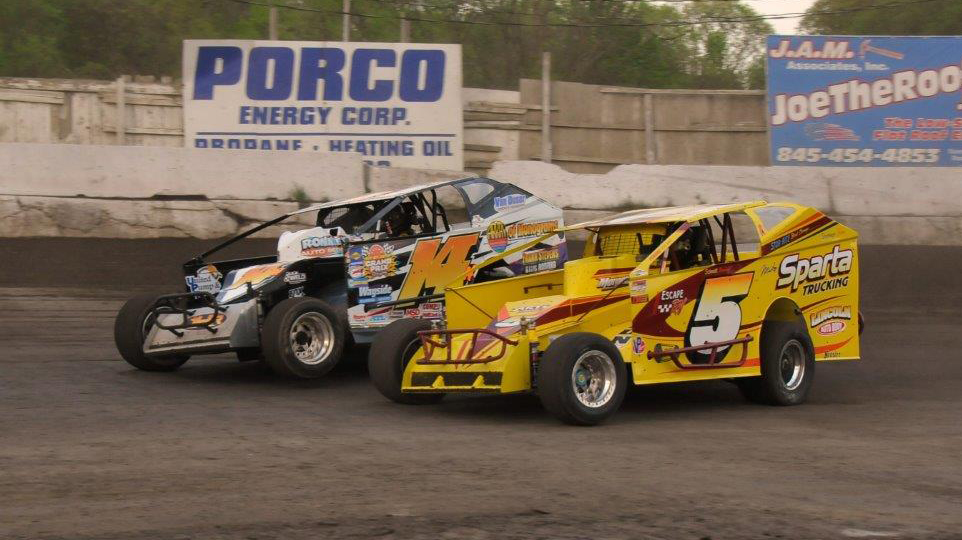 Jeff Heotzler, 14H, passes Tommy Meier on the outside of turns 3 and 4 at the Orange County Fair Speedway in Middletown, New York on May 9th, 2015.